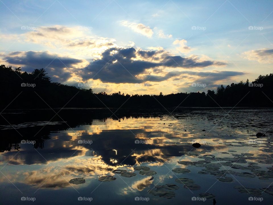 Lake reflection. Clouds reflected on lake