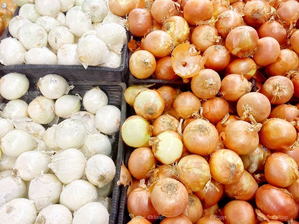 Onions. Various types of onions for sale at a store. 