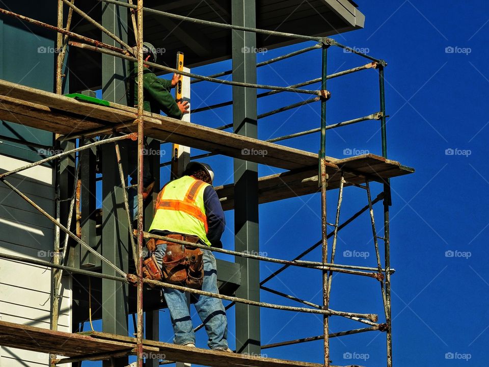 Construction Engineers. Workers on a skyscraper