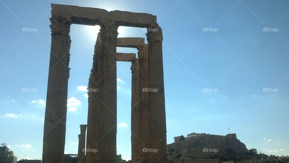 Temple of the Olympian Zeus,  Athens, Greece,  with Parthenon and Acropolis in background