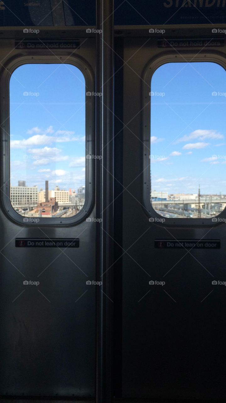 Frames within a frame: city skyline seen from the subway 