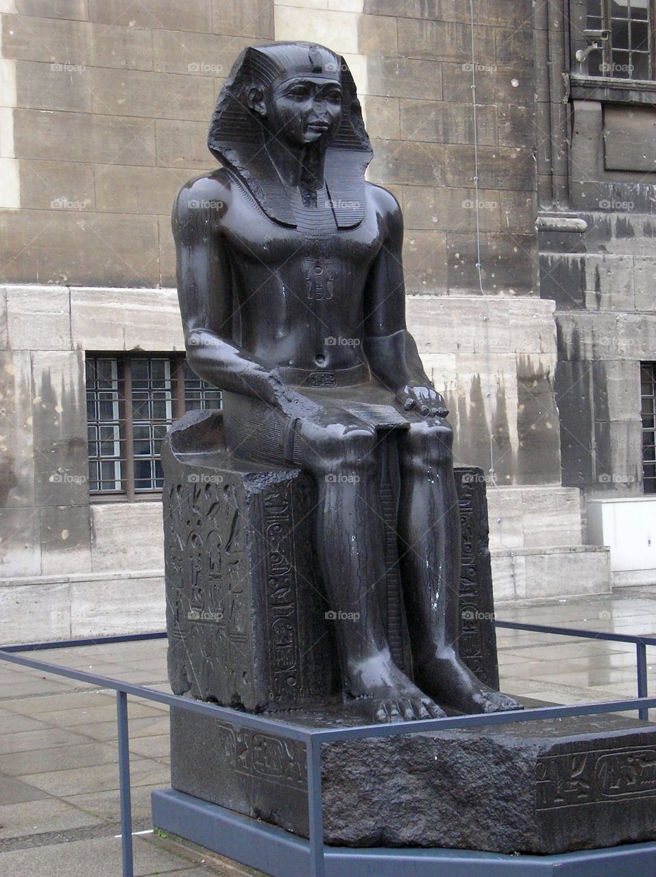 A black statue in front of Pergamon museum in Berlin