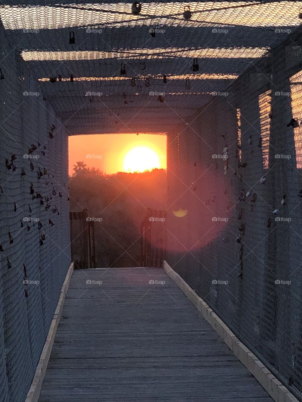 Sunset at lock bridge at Villano Beach