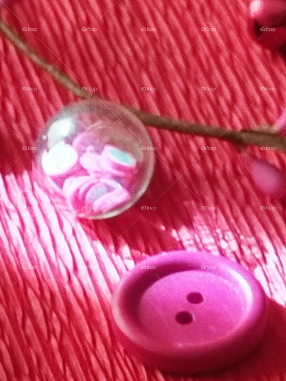 botón bola cristal con flores magenta