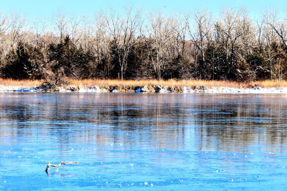Stunning blue frozen pond. Perfect ice skating weather. "Glide With Me".