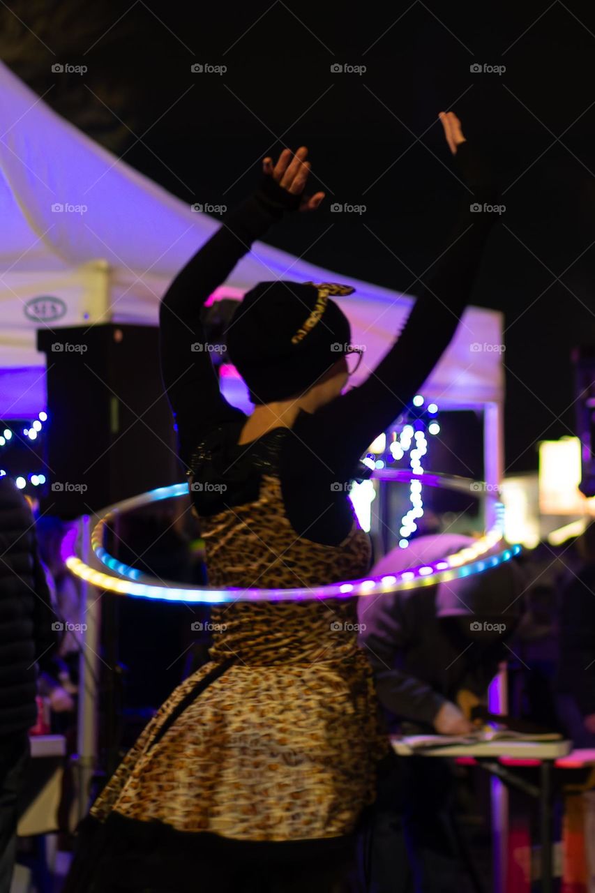 Moonlight Market in my small town is an annual pre- Christmas event on or around a full moon. It’s always an event full of fun food, music & activities like this woman in a fun costume twirling her twinkling lights hula hoop!