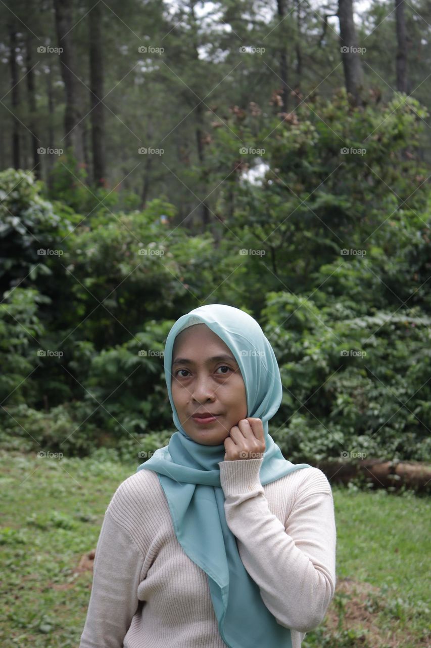 portrait of woman standing in the field