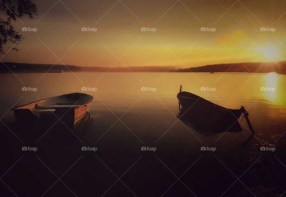 Scenic view of lake at sunset