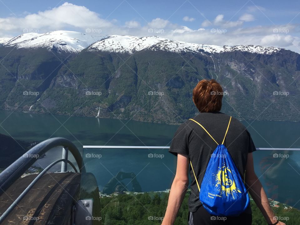 Appreciating the amazing fjord on the top of mountain 