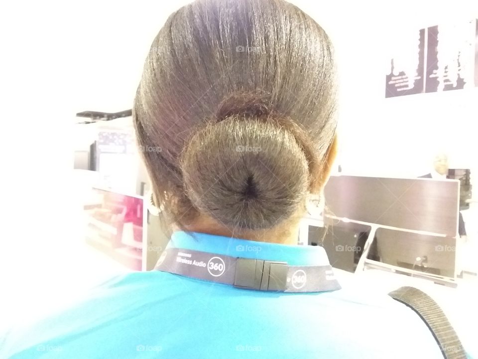 Brown hair neatly packed into a tidy bun