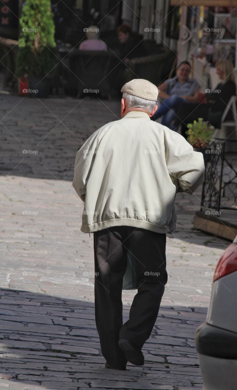 Man taking a stroll in lake orchid Macedonia 