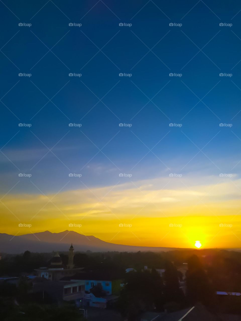 The view of the morning sun rising behind the mountains in early January 2021 in Kupang City, East Nusa Tenggara or NTT-Indonesia.