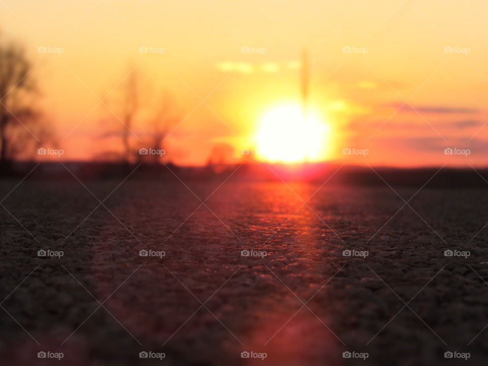 Road with sunset background 