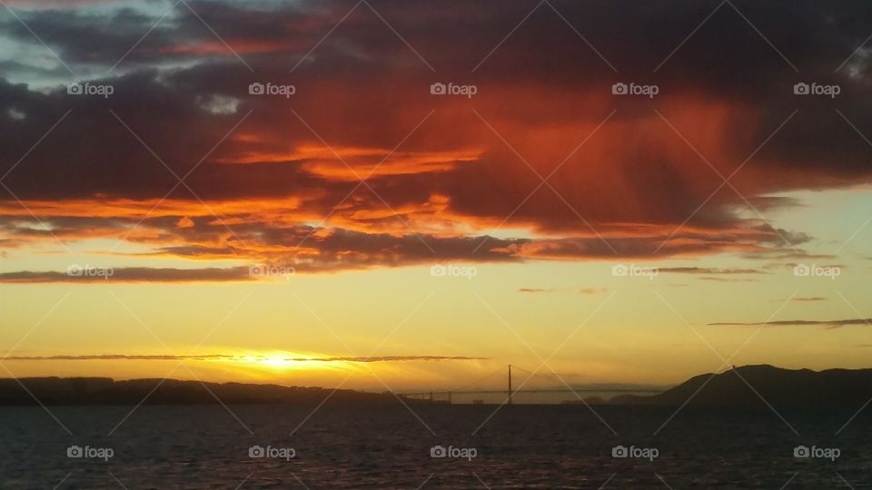 sunset in San Francisco raining in the bay