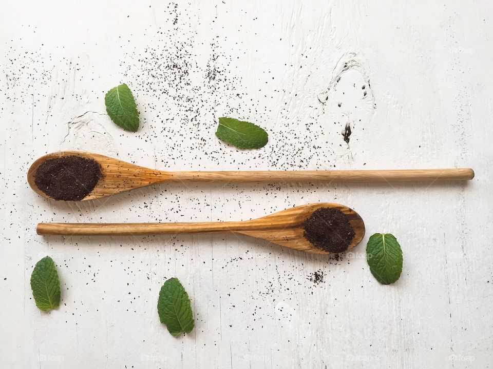 High angle view of tea leaves and mint leaf
