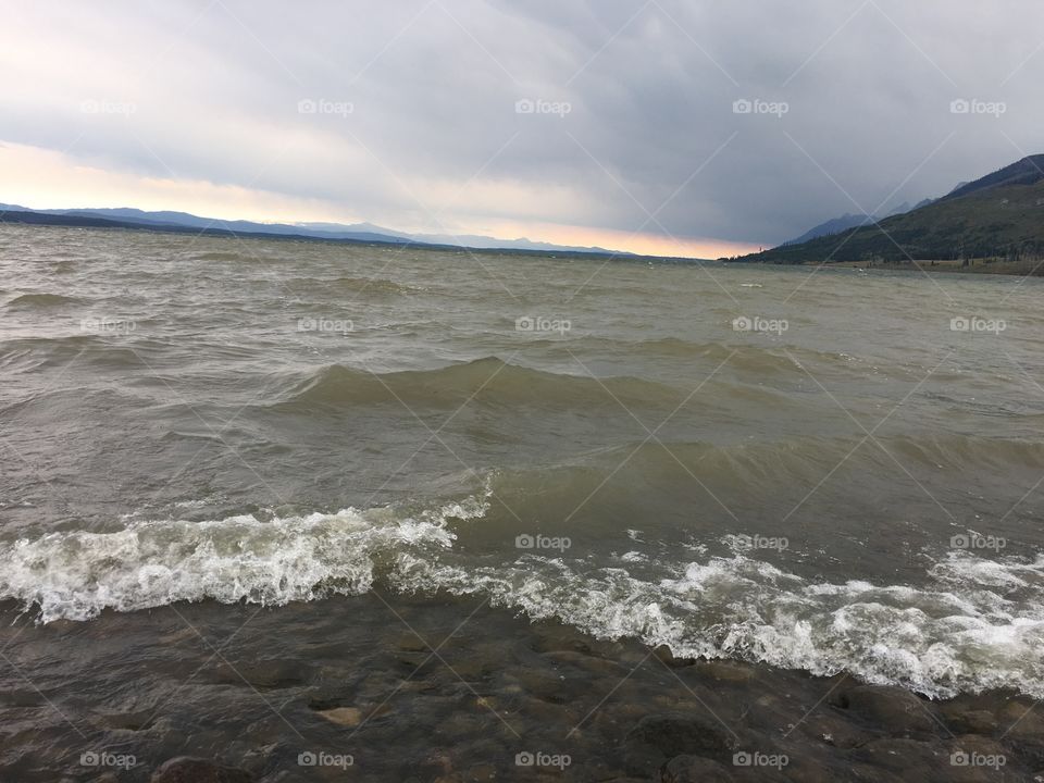 Water rushing up in shore during impending storm in Wyoming