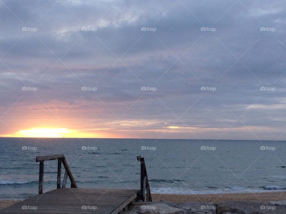 Sunset and stairs by the beach 