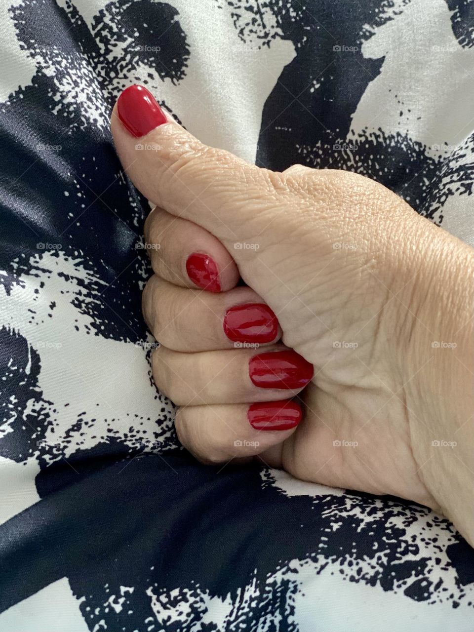 Hand with red manicure 