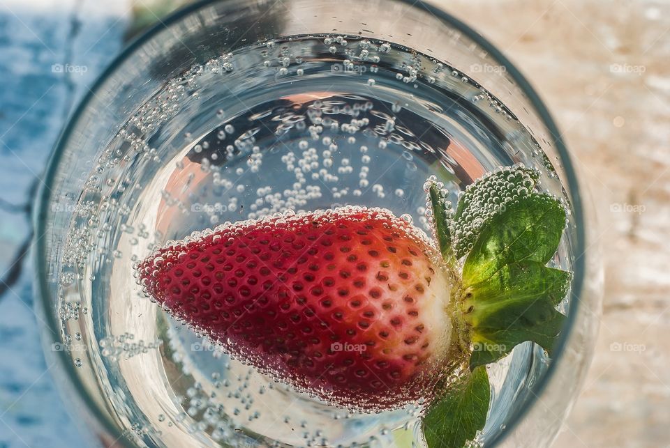 High angle view of strawberry in drinking glass