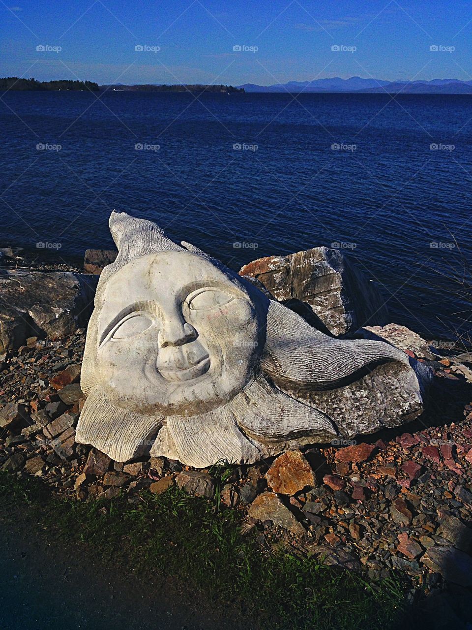 Carved rock in the shape of sunshine makes me smile - happy grey mission