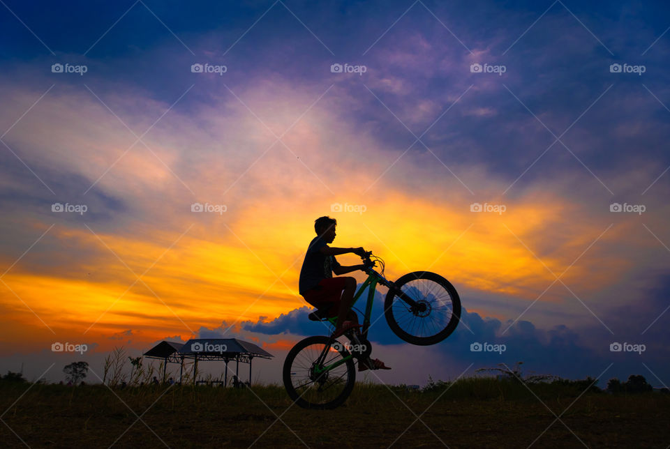 Enjoying Sunset with Riding Bicycle