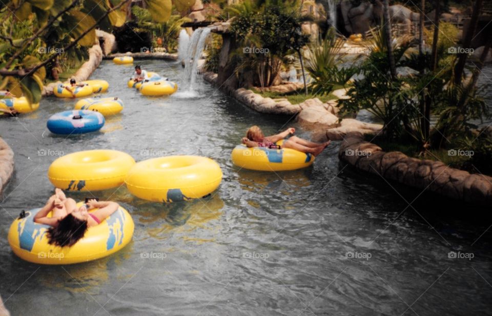 Floaters in an artificial river of a Thermal Water Park. A very relaxing way to enjoy the vacation and have fun during Summertime.