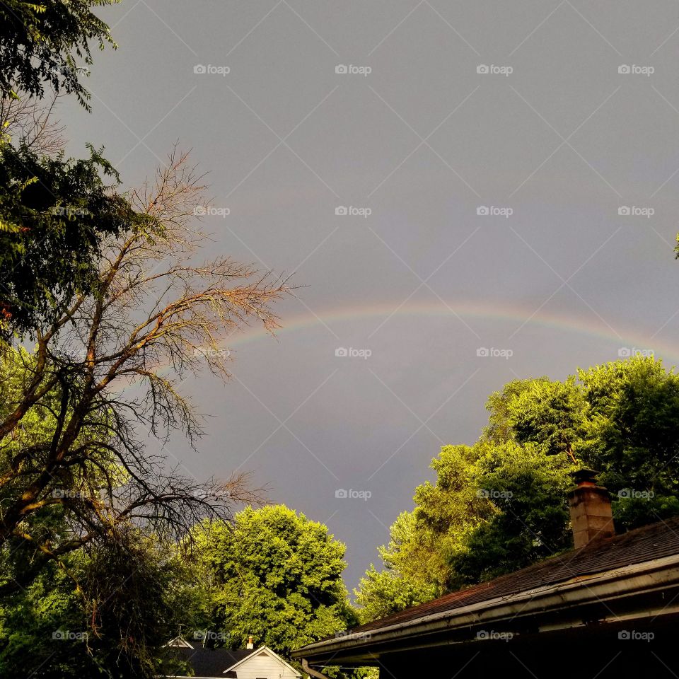 Beautiful rainstorm with a double rainbow