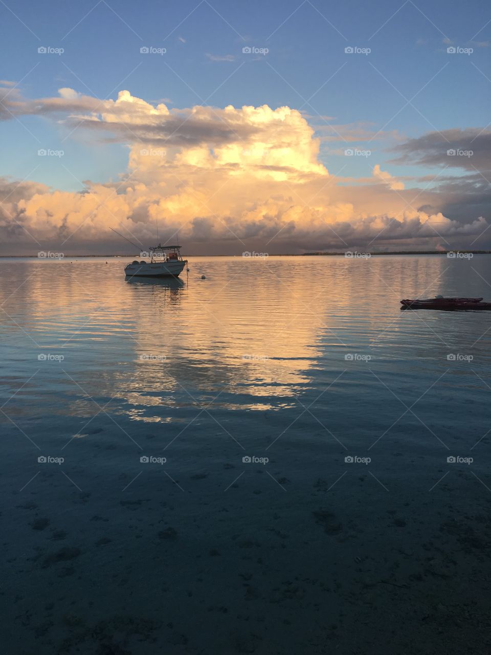 Silhouette of a boat on Tuamotu atoll