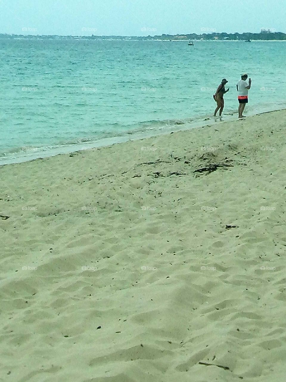 the photo is one  of a kind  I love how this man and woman just come Cate in to each other with out a cell phone