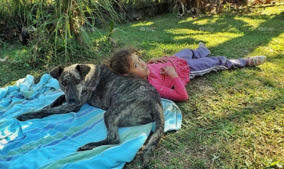 dog and girl resting