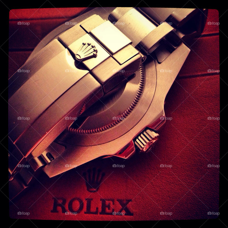 Watch on brown leather wallet