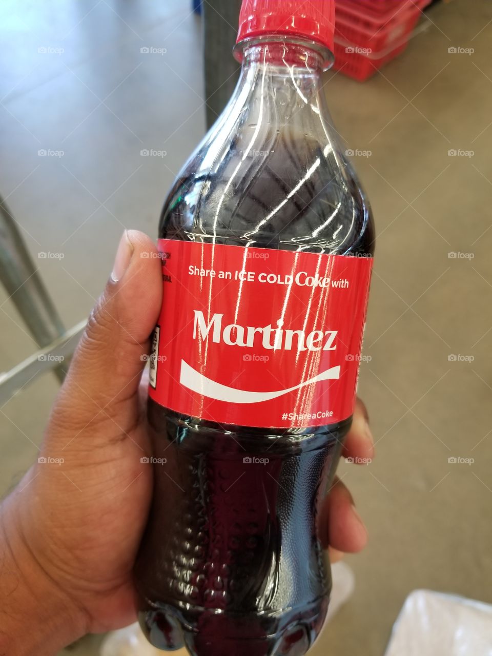 finding your last name on a coke bottle during the "share a coke " promotion for coca cola