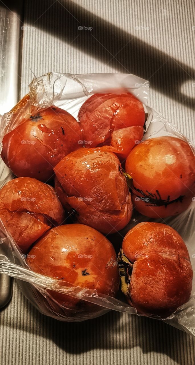 On the plate Orange color juicy fruits food date-plum