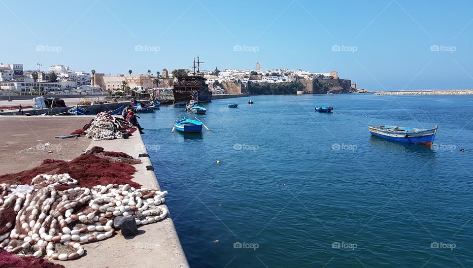 Rabat Morocco beach sea boat mosque city . old city