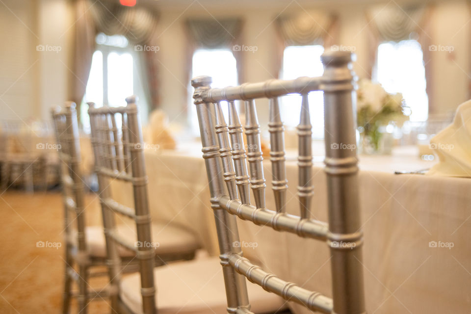 Gold chivari chairs at wedding reception