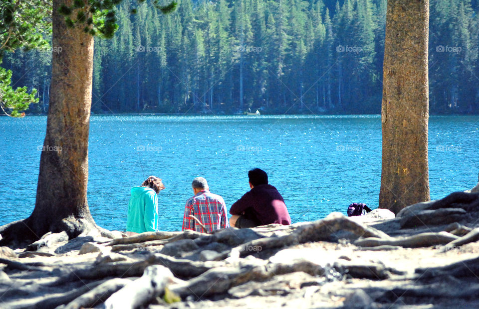 People at the lake ready for fishing during summer