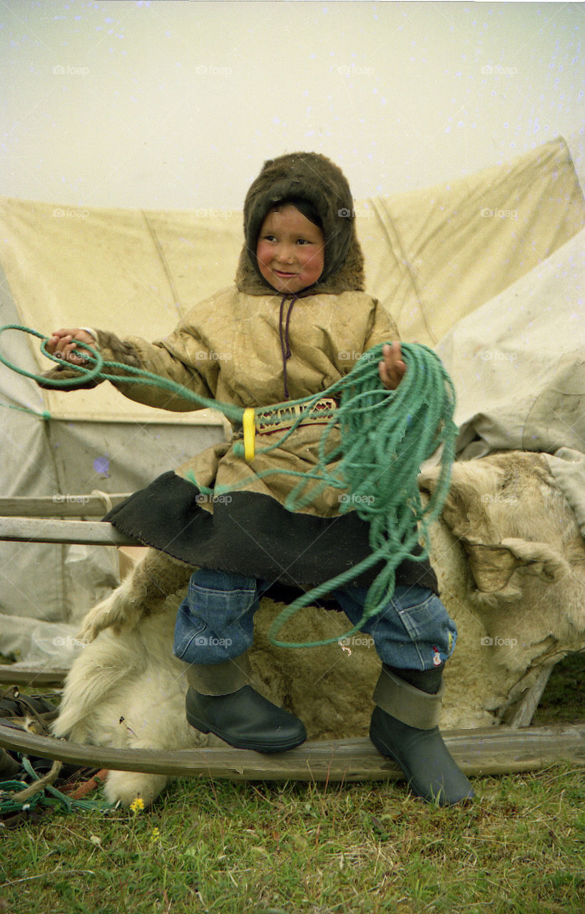 A boy with a lasso.