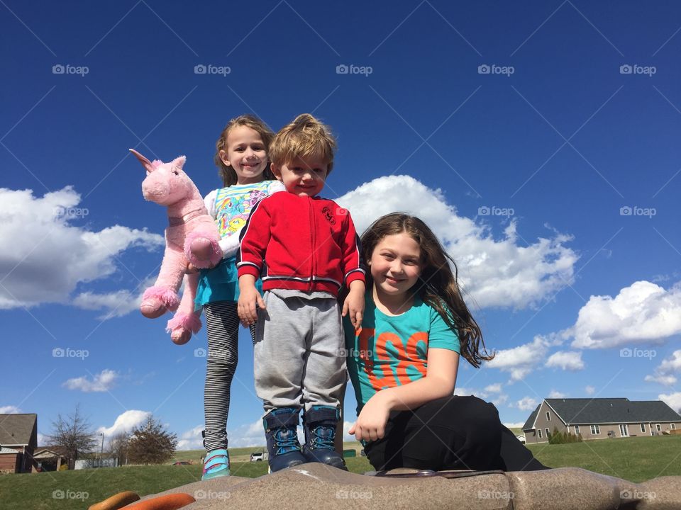 Portrait of smiling brother and sisters