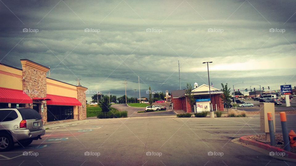 Thunderstorm Moving In. A thunderstorm was moving in as I ran err
ands in Independence, Missouri. I added vibrancy and blur for dramatic effect.