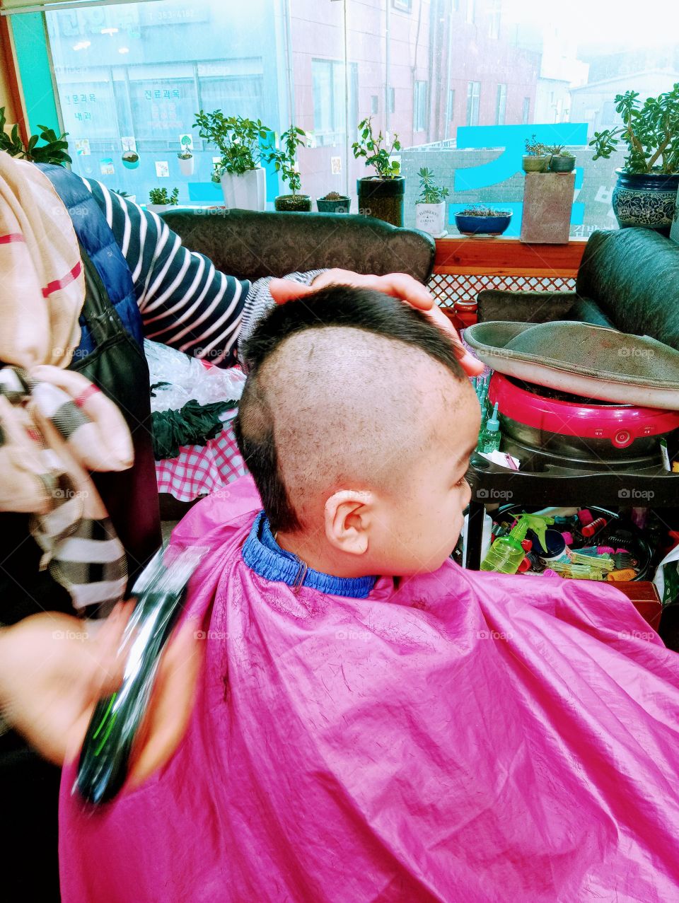 A Korean bOy at the parlor.
