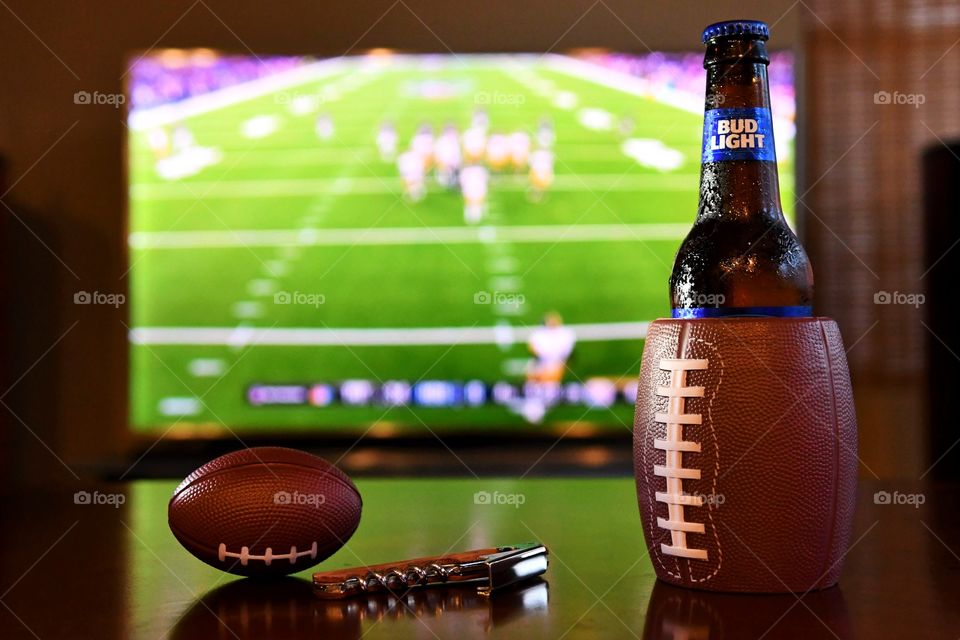 Watching football with Bud Light beer