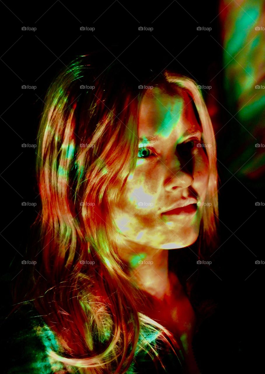 Girl lighted with galaxy-light, red