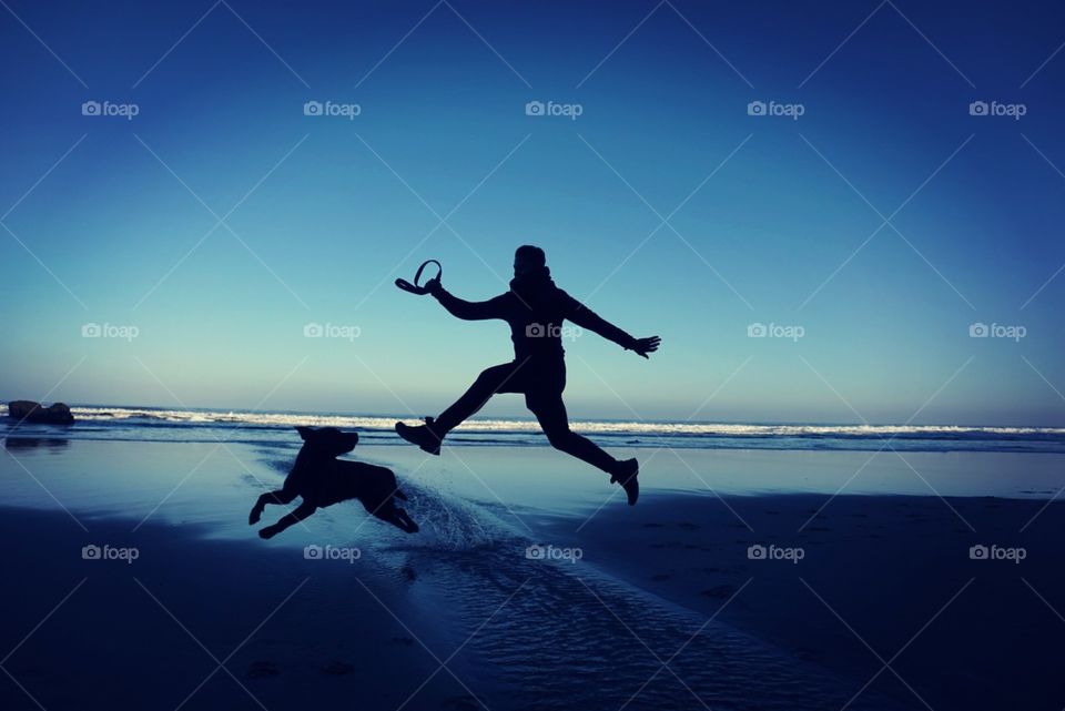 Beach#sky#jump#human#dog#ocean