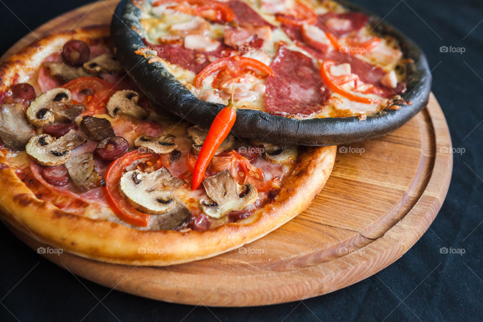 black pizza with chilli