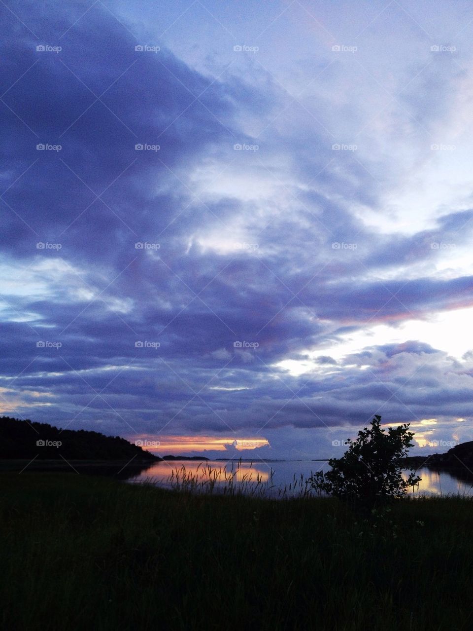Reflection of sky at sea at sunset
