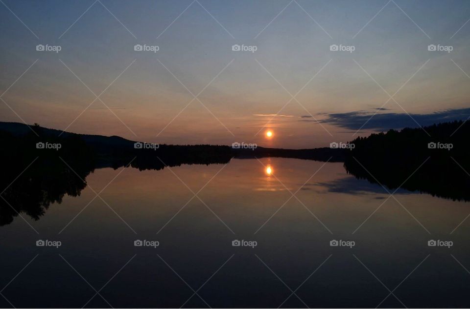 swedish sun reflection at midnight in summer 
