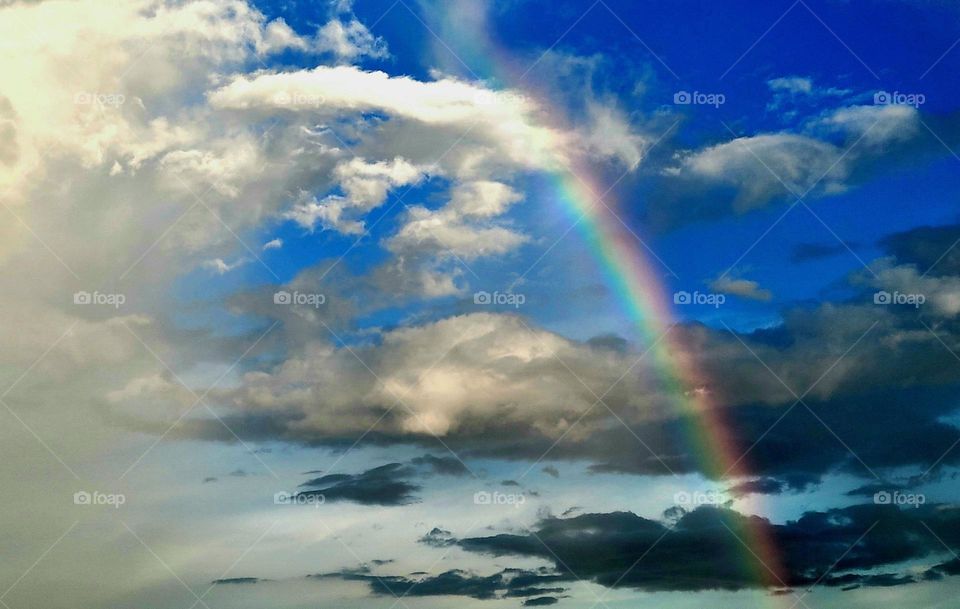 A glimpse of a rainbow in the sky