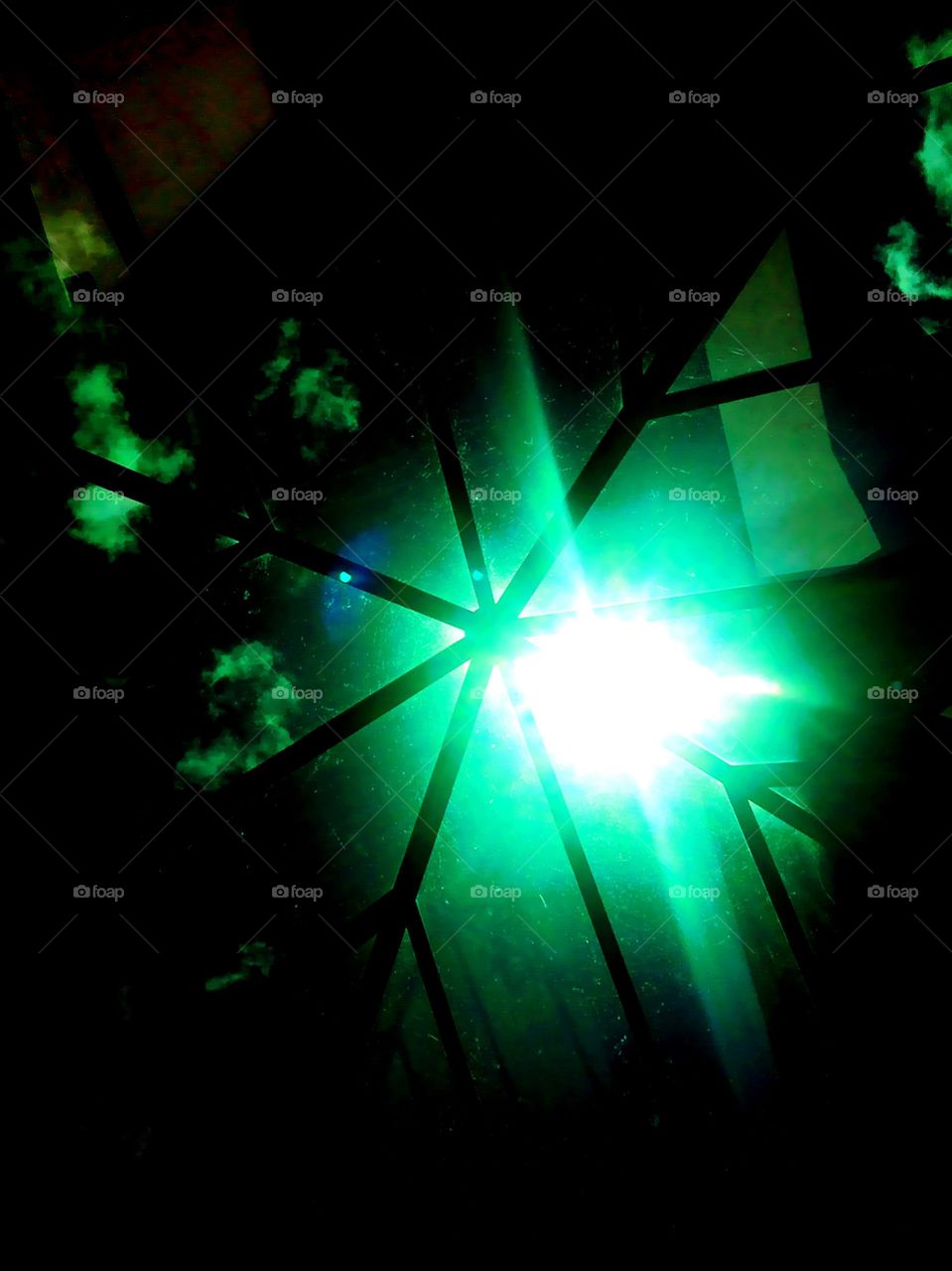 The sun shining through the skylight.