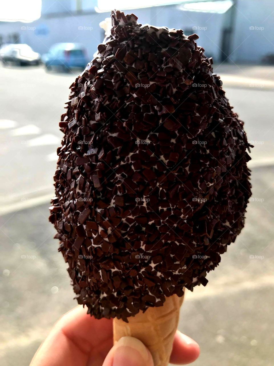 Chocolate chip covered vanilla icecream cone