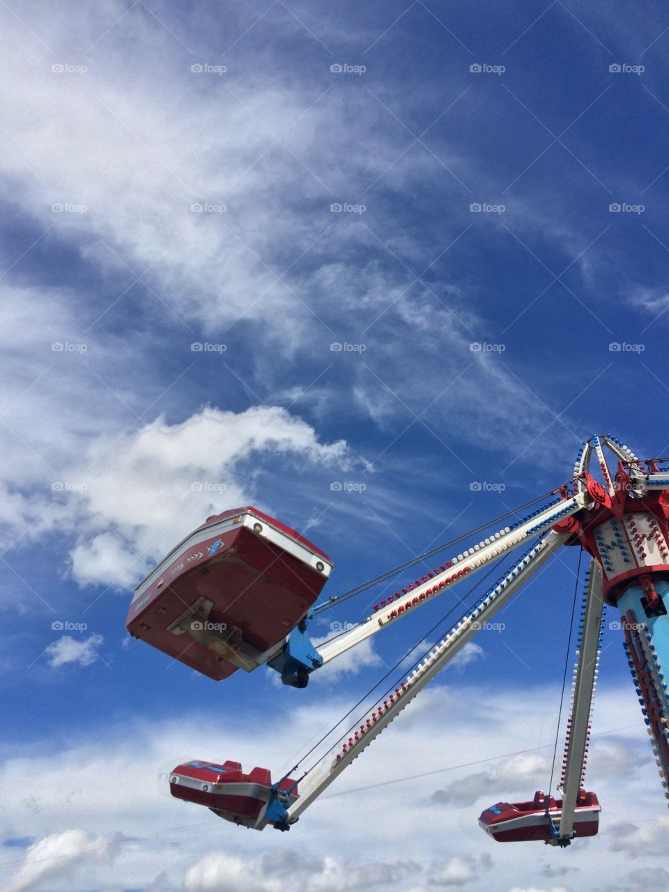 Moods of the weather, beautiful blue sky with white clouds during a carnival ride